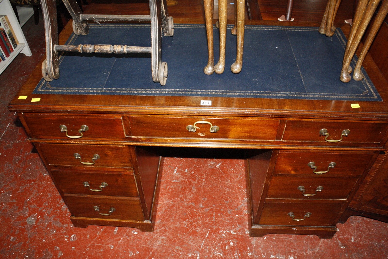 An early 20th Century twin pedestal desk with nine short drawers 122cm wide £100-150