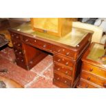 A mahogany Victorian style kneehole desk.128cm wide x 69cm deep x 80cm high. £200-300