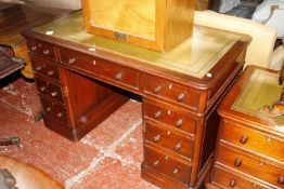 A mahogany Victorian style kneehole desk.128cm wide x 69cm deep x 80cm high. £200-300