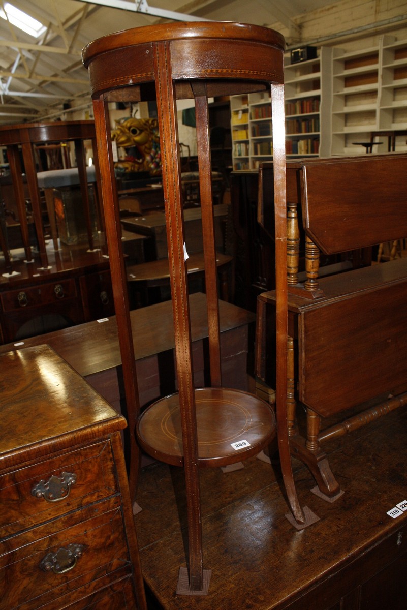 A late Victorian mahogany two tier drop leaf table and an Edwardian mahogany plant stand £40-60