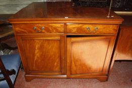 A reproduction mahogany side cabinet with cupboards and two frieze drawers.123cm wide x 99cm