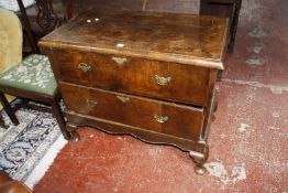 A walnut chest of two drawers on short cabriole legs.97cm wide x 50cm deep x 83cm high. £100-150