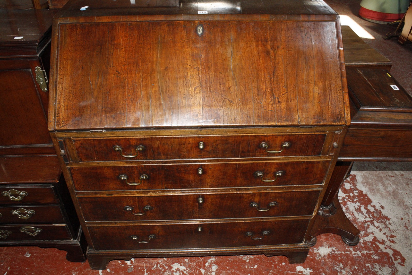 A George III mahogany bureau with four long drawers on bracket feet 96cm wide £150-250