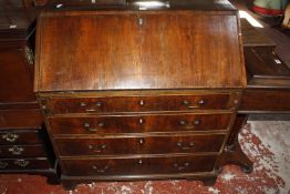 A George III mahogany bureau with four long drawers on bracket feet 96cm wide £150-250
