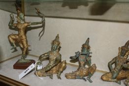 A group of six verdi gris gold finished bronze Thai musicians 14cm high and a Thai dancer. £350-400