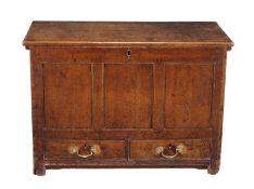 A George III oak mule chest, circa 1770, the lift top opening to large compartment with triple panel
