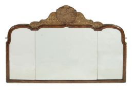 A walnut and giltwood wall mirror in Queen Anne style, circa 1900, with dolphin form to gilded