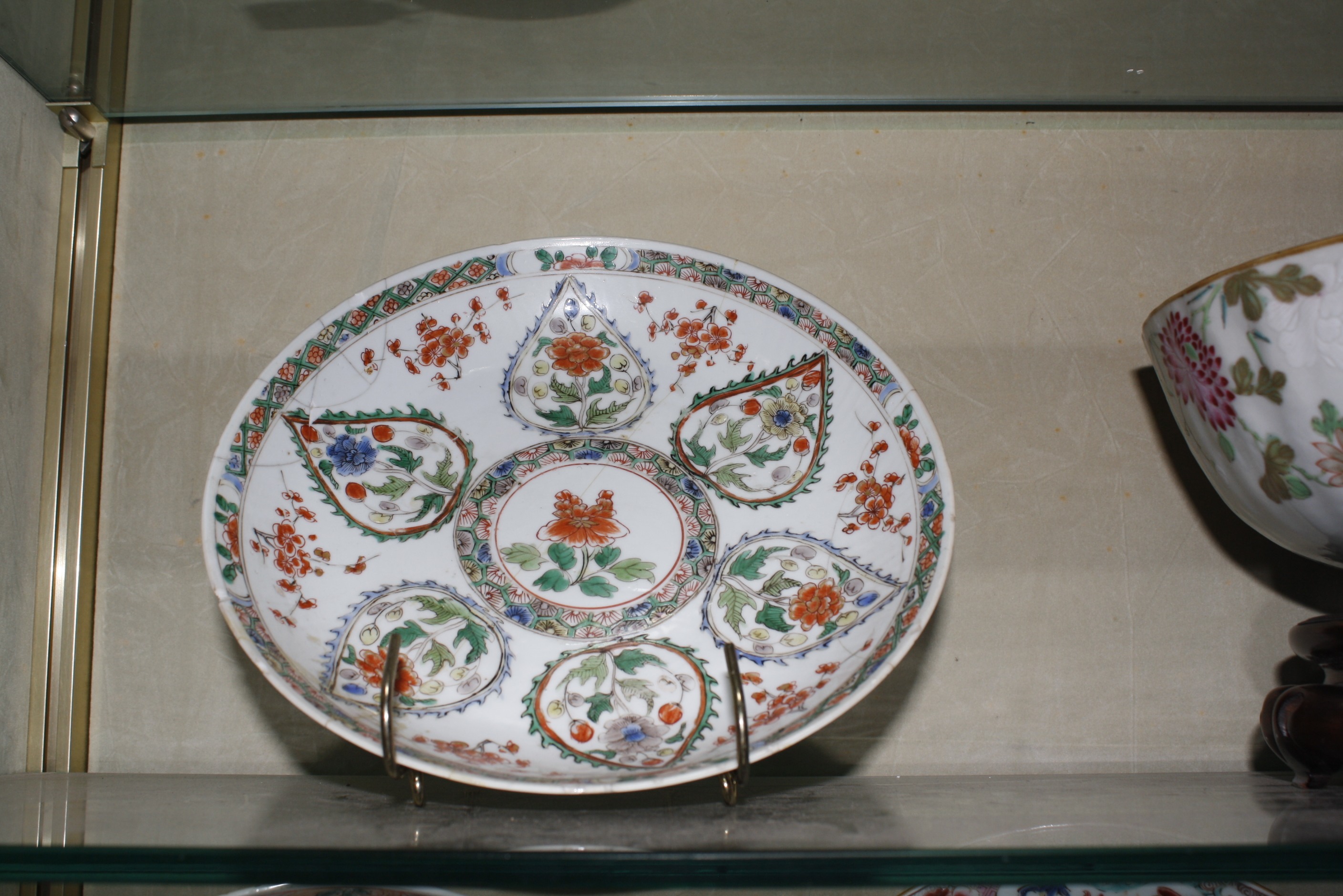 Five oriental plates and two oriental bowls and a hardwood stand. £120-180 - Image 2 of 2