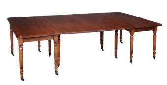 A Regency mahogany dining table, circa 1815, the central leaf section with revolving action to