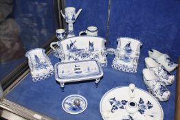 A small quantity of early 20th century blue and white Delft, including clogs, three piece suite,