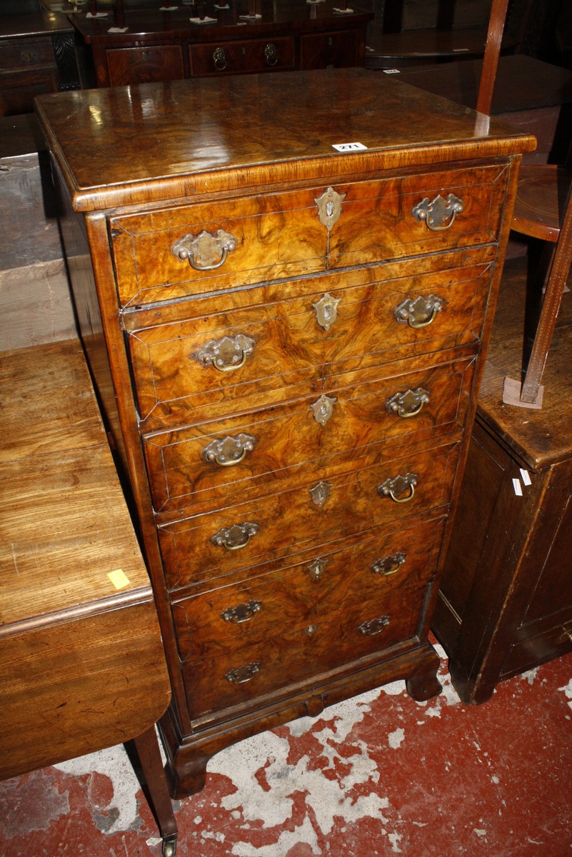 A walnut and crossbanded tall chest of drawers, early 20th century comprising six long drawers,