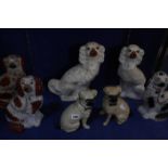 A group of assorted Staffordshire spaniels, together with a near pair of seated pug dogs (14) (