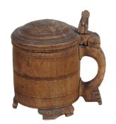 A Scandinavian carved and stained birch peg tankard, 18th century, the domed circular cover