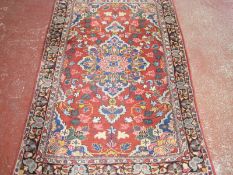A Persian Sarough rug 200 x 120cm £120-180