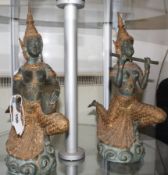 A pair of verdi gris and gold finished bronze figurines of female Thai dancing musicians.41cm