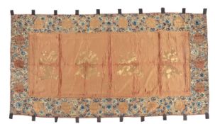 A large red ground silk celebration banner, circa 1870-1880, embroidered with Shou characters around