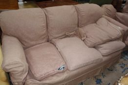 An upholstered armchair, circa 1900 £100-150