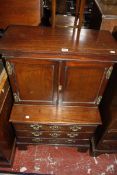 A George III miniature cabinet on chest, circa 1780 and later, the cabinet top with moulded