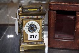 A French early 20th c champleve enamel carriage clock and case.11.5cm high. £120-180