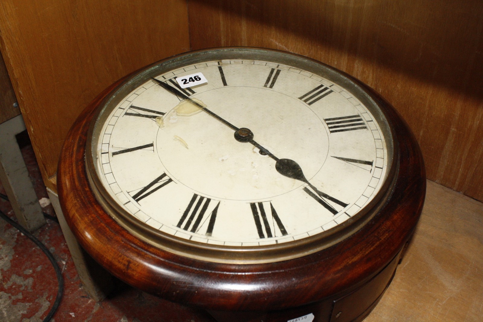 A 19th Century circular mahogany wall clock with painted dial. £60-80