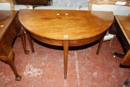 A mahogany demi lune table £40-60