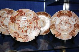 Four Japanese Imari porcelain plates and two matching saucer dishes £60-100