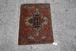 An antique Persian Feraghan 81 x 60cm £40-60