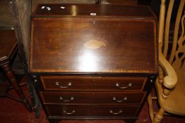 An Edwardian mahogany and marquetry bureau with three long drawers 76cm wide £40-60