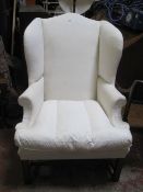 A Georgian style wing armchair with mahogany frame £100-150