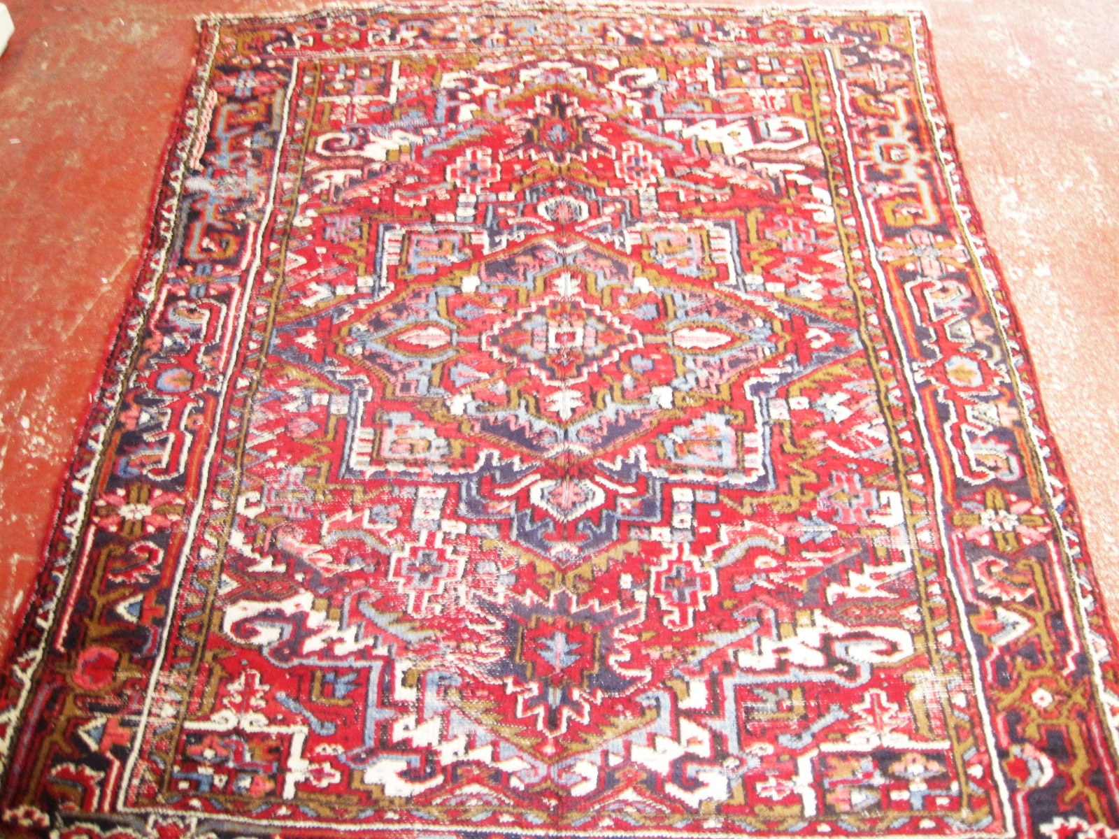 A Persian Heriz carpet 250 x 212cm £100-150