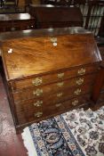 A George III mahogany bureau with four long graduated drawers 102cm wide £200-300