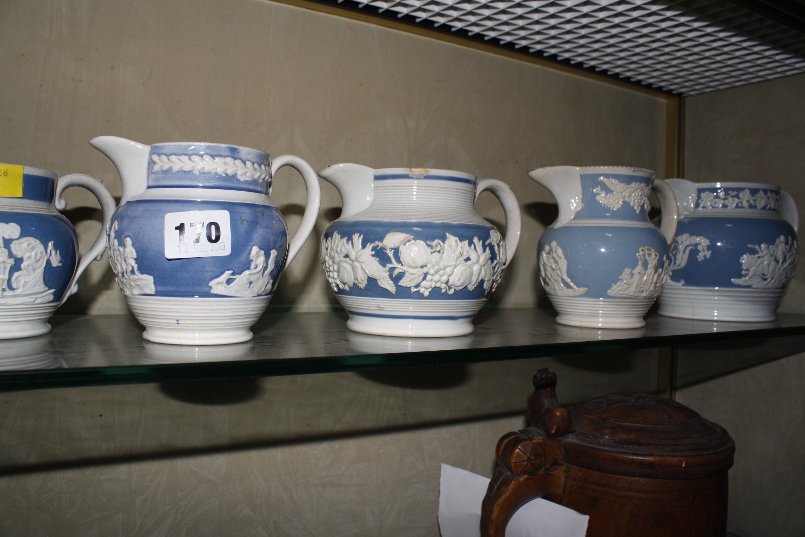 Five early 19th c blue and white baluster jugs and two further jugs in brown and cream £40-60