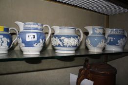 Five early 19th c blue and white baluster jugs and two further jugs in brown and cream £40-60