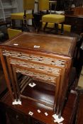 A nest of three Chinese hardwood tables, the largest 44cm wide £100-150
