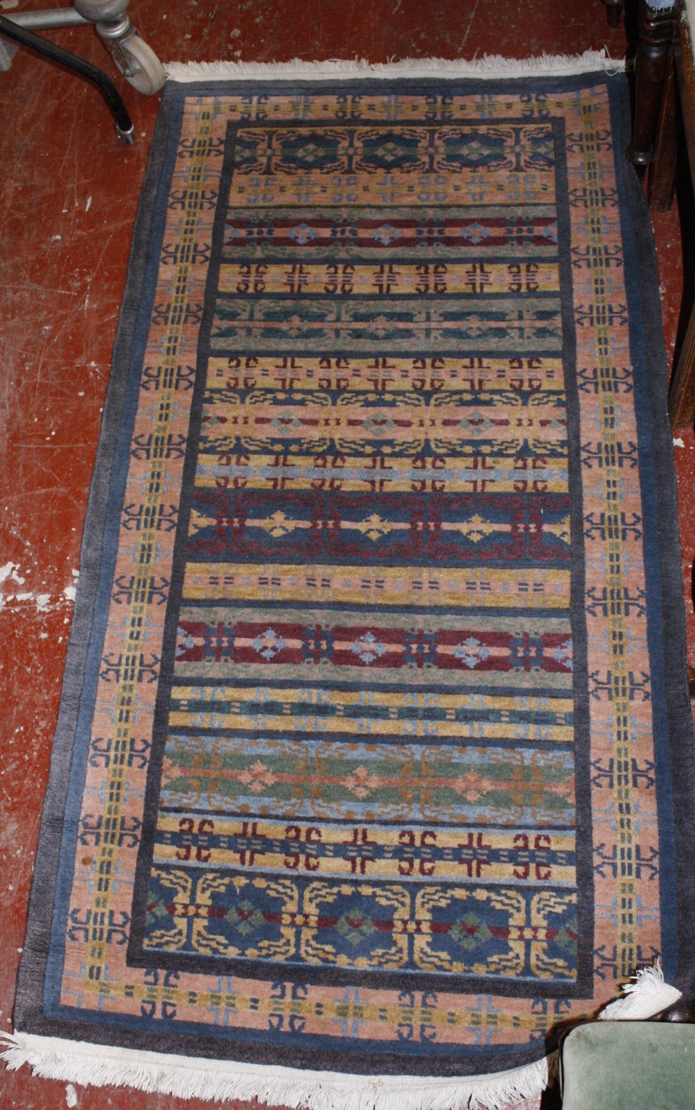 An Oriental runner, with stylized all over decoration approx 95 x 186cm