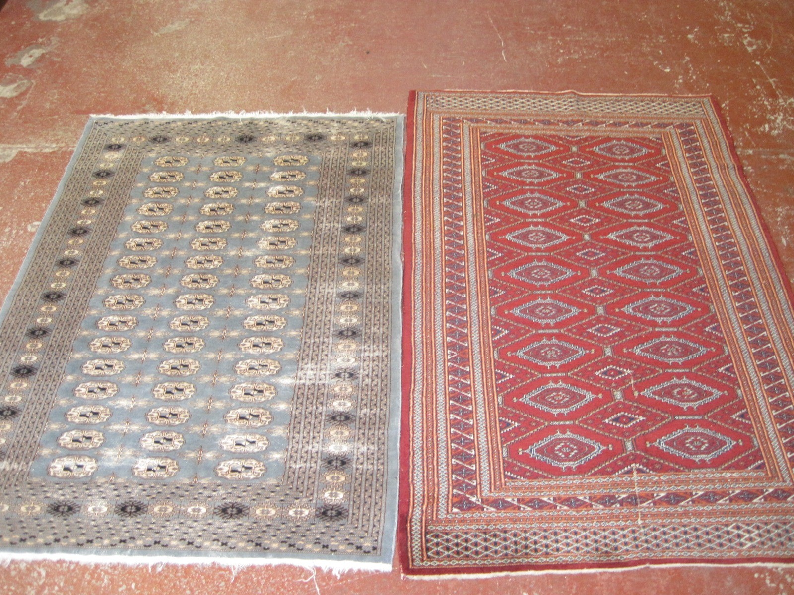 A Pakistan Bokhara rug, and another pale blue Bokhara rug