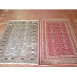 A Pakistan Bokhara rug, and another pale blue Bokhara rug