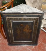 A painted and parcel gilt hanging corner cabinet