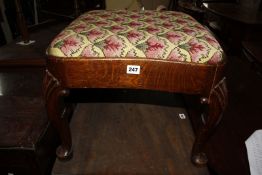 A 19th century oak foot stool on shell crested cabriole supports. Best Bid