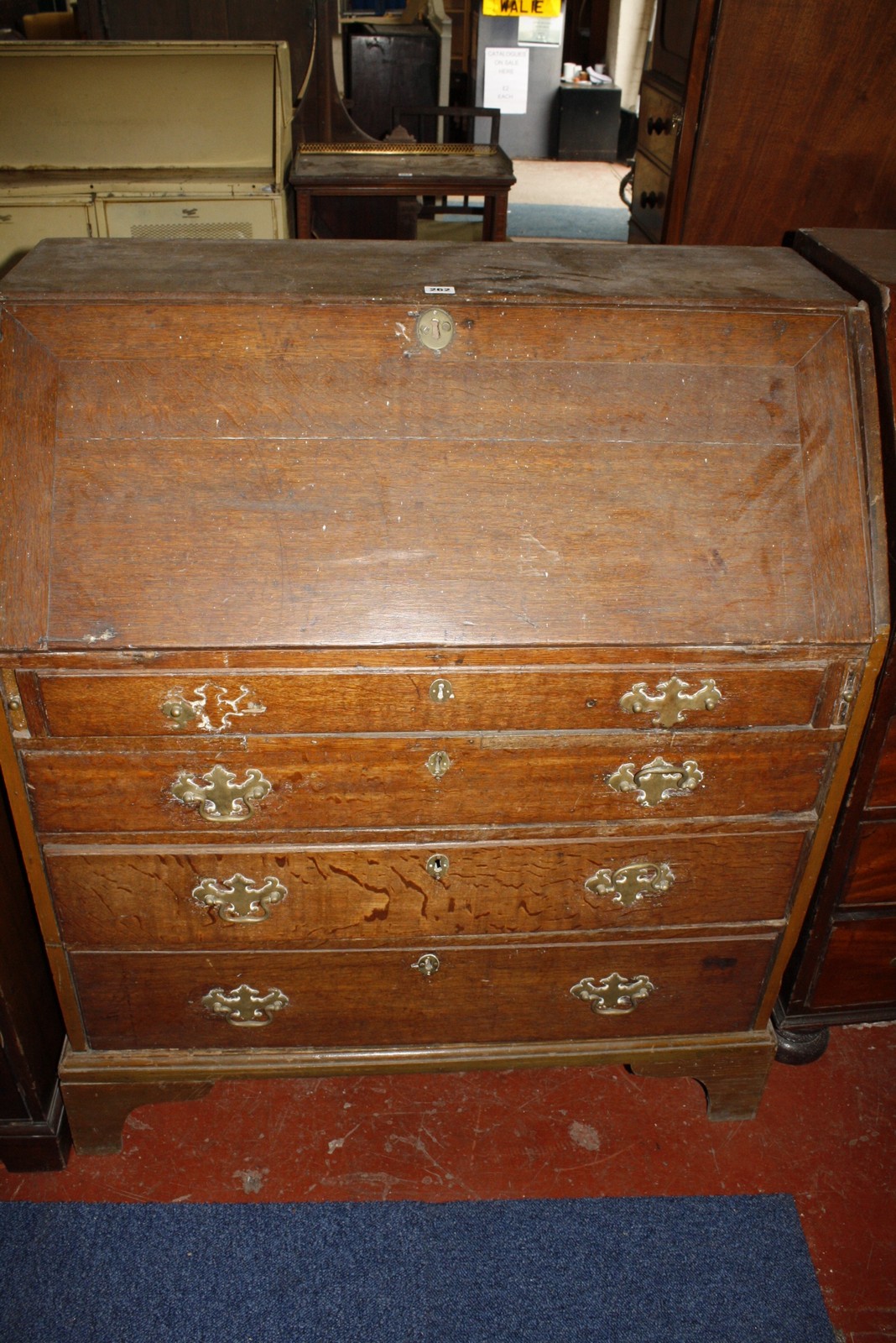 A late George III oak bureau 110cm high, 92cm wide (a/f) Best Bid