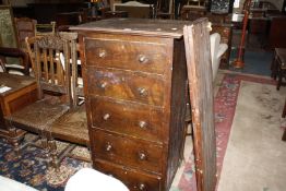 An oak five drawer chest, pair of Victorian oak dining chairs and an oak blanket chest