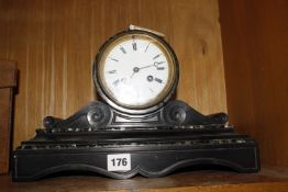 A black marble mantel clock