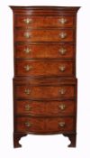 A burrwood serpentine fronted chest on chest in George III style, 20th century, 174cm high