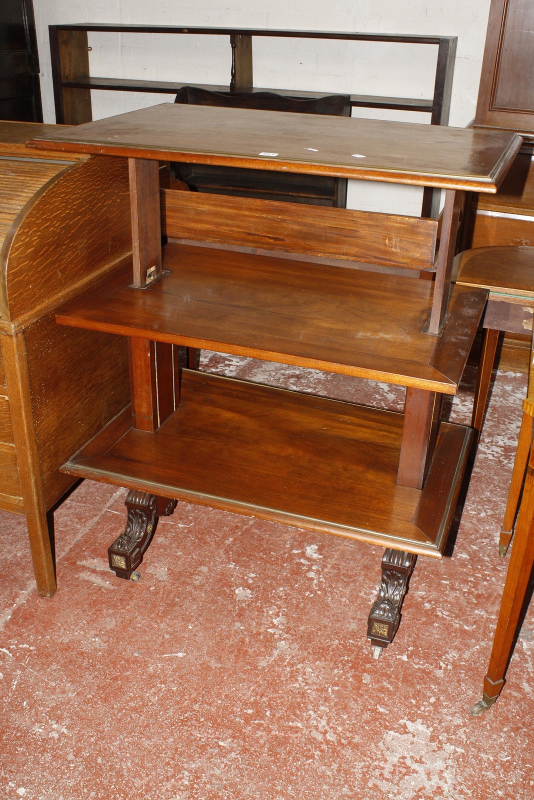 A 19th Century French mahogany dumb waiter, with three adjustable rectangular tiers on square