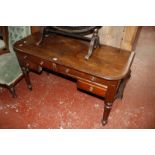 A mahogany kneehole writing table and a rectangular wall mirror Best Bid