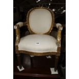 A Louis XVI style giltwood child's chair.