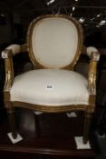 A Louis XVI style giltwood child's chair.