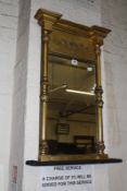 A Regency gilt overmantel mirror, the frieze with trailing foliage, the plate flanked by columns