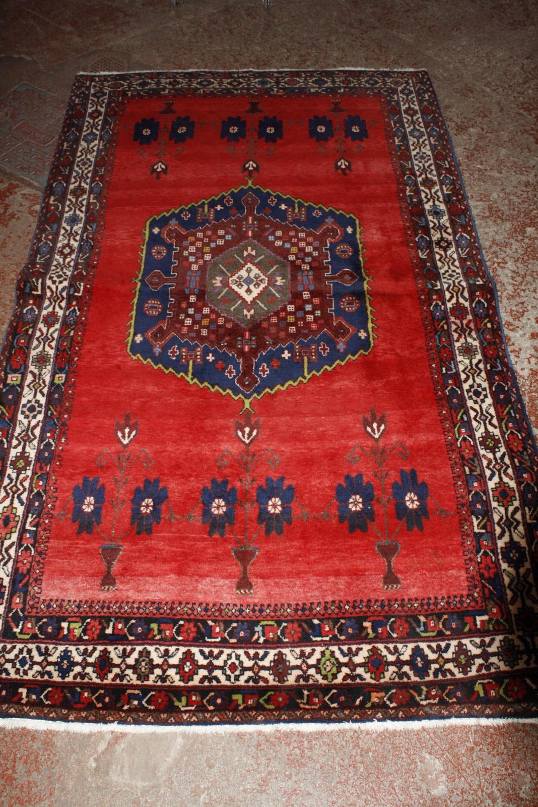 A red Afshar carpet 277 x 164cm