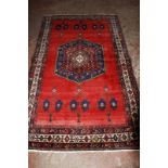 A red Afshar carpet 277 x 164cm